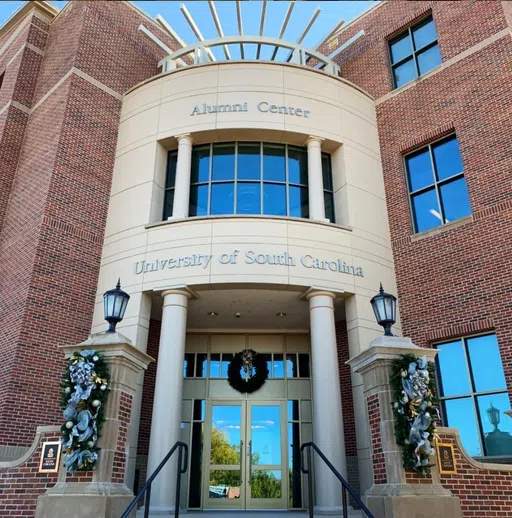 View of the front of the Pastides Alumni Center during the day