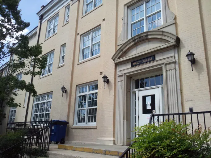 View of the front of Maxcy College during the day