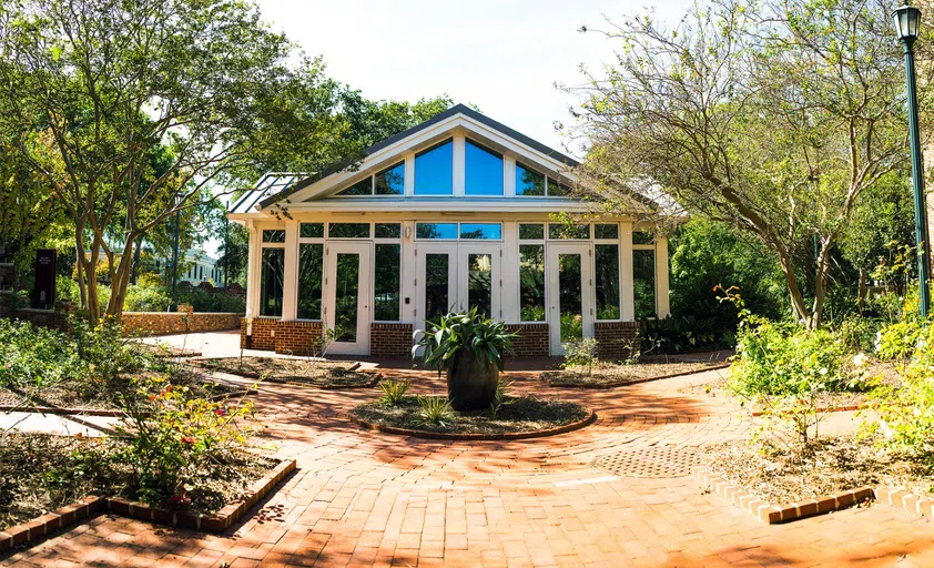 View of the front of the Kennedy Greenhouse Studio during the day