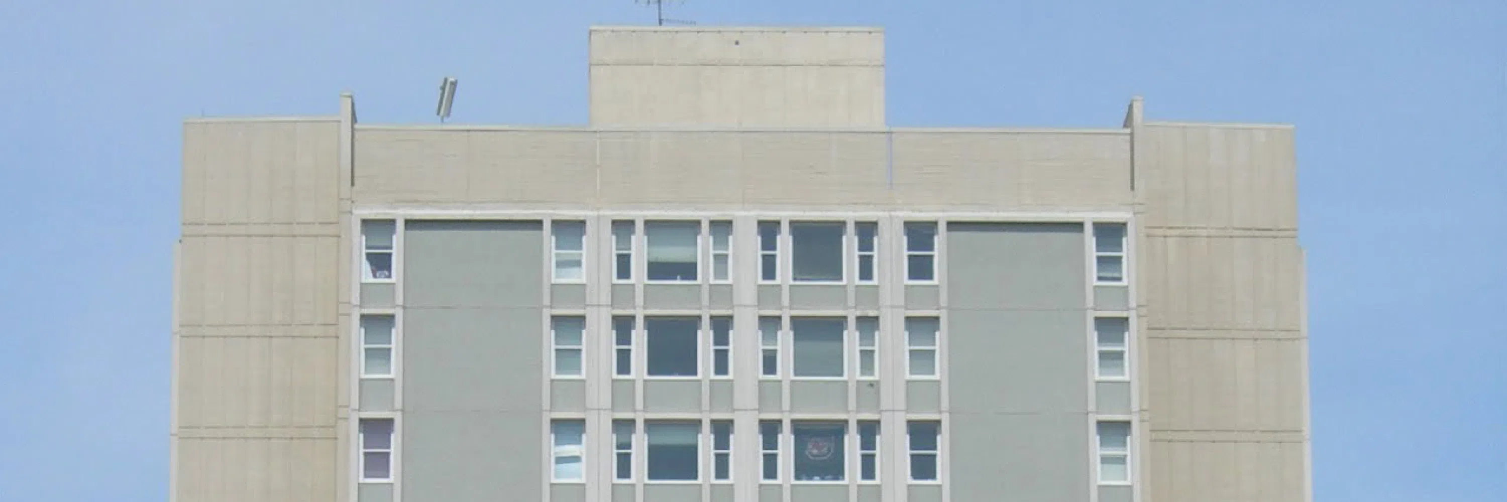 Close up view of the top of Bates West during the day