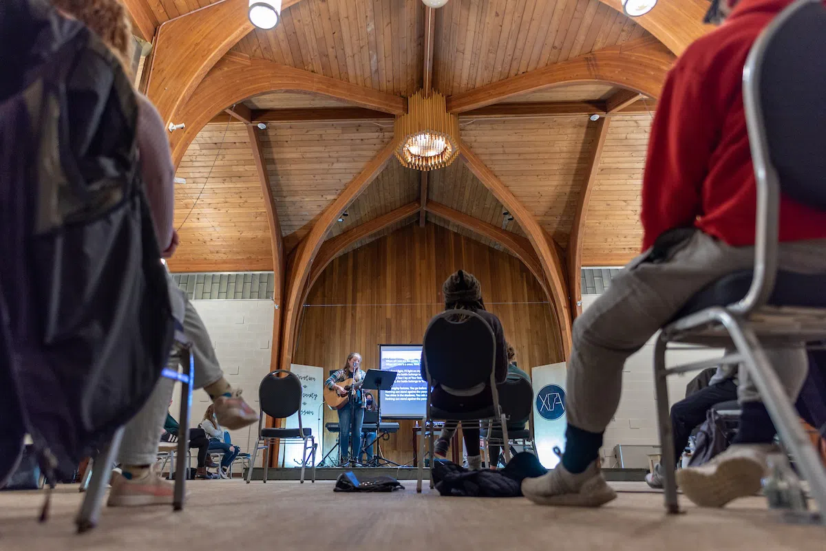 Student playing guitar in the UVM Interfaith Center.