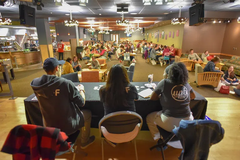 Students sitting at tables in Brennan's playing bingo