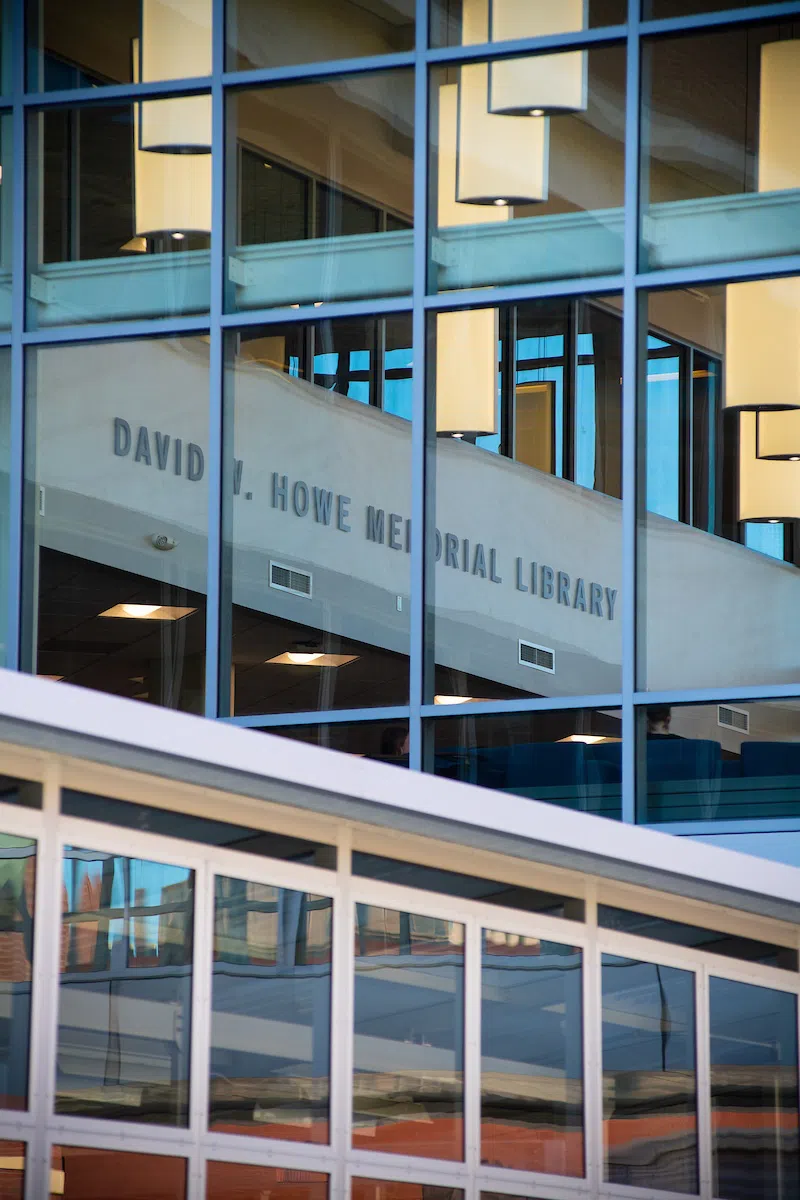 Reflection of Howe Library in glass window