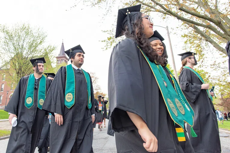 Candid photo of students in cap and gown 