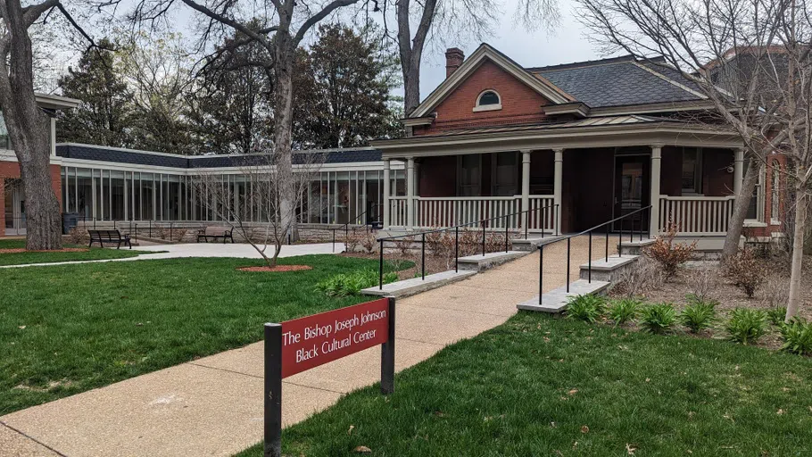 Exterior photo of the BCC showing a path up to the brick building