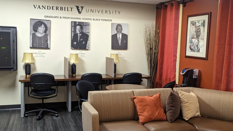 Interior photo of the BCC showing the grad student lounge including sofas and work desks