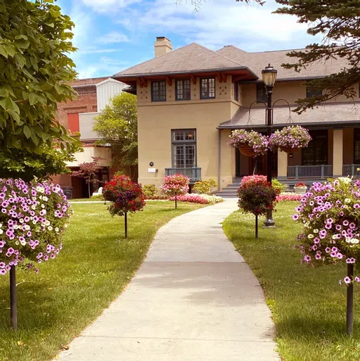 Kautz Admission House with a sidewalk leading to the front entrance