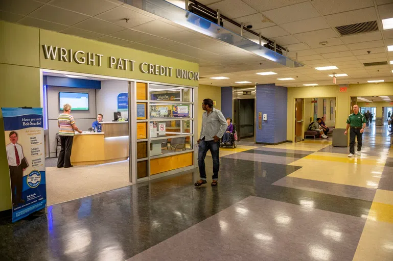 The image shows the front entrance to the Wright Patt Credit Union inside the Student Union.