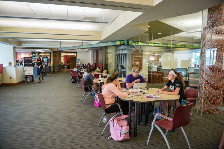 Students studying and eating at the ReyRey Café.