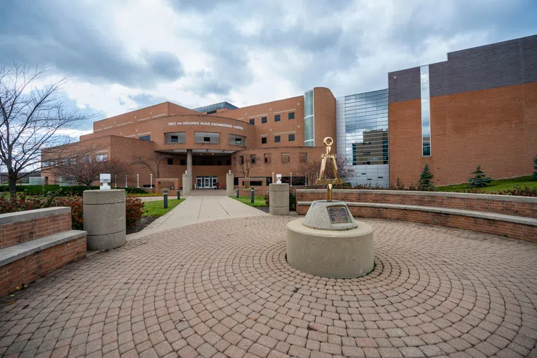 The photo shows the outside of the Fritz and Dolores Russ Engineering Center.