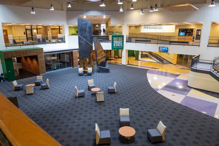 The image shows the Student Union Atrium with a variety of seating options. 