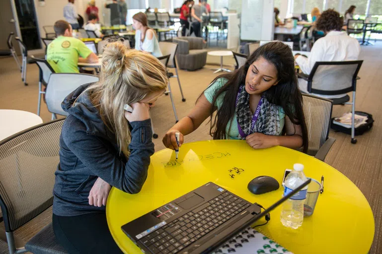 Tutor helping a students in the Math Learning Center.