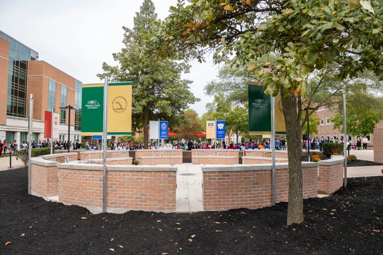 Memorial plots with banners representing each of the historically African American fraternities and sororities in the National Pan-Hellenic Council