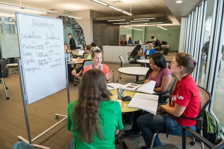 Students work in the Student Success Center in a group session.