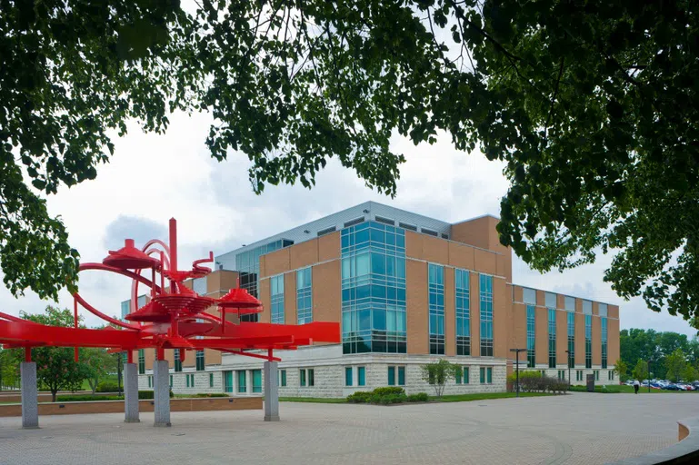 The outside of University Hall. Also in the picture is Turning Points, a sculpture that sits as a center point on campus.