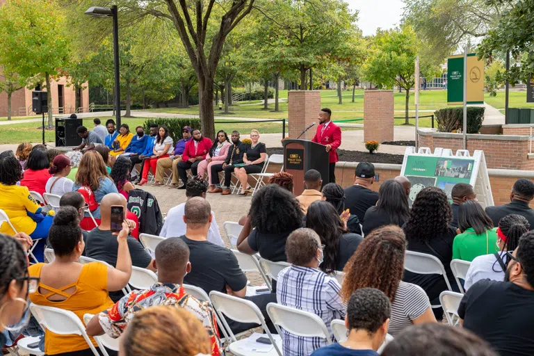 Students, staff, faculty, alumni, and family attend the groundbreaking celebration for the National Pan-Hellenic Memorial Plots