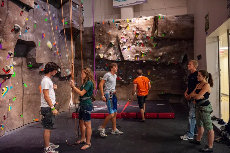 Students using the rock climbing wall in the Student Union.