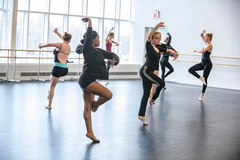 Dance major students work on a dance in a dance studio in the Creative Arts Center. 