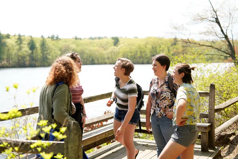 Wellesley students on a Lake Waban dock