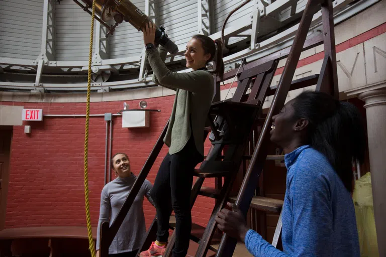 Wellesley students using the telescope in the Whitin Observatory