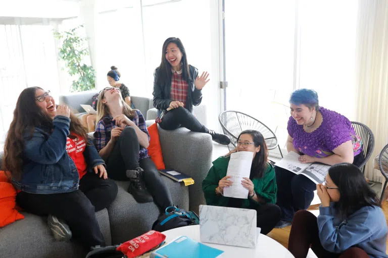 Wellesley students hanging out in Acorns House