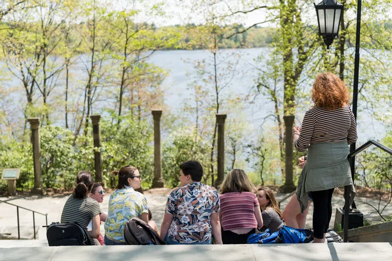 Wellesley students on Tower Court steps overlooking Lake Waban