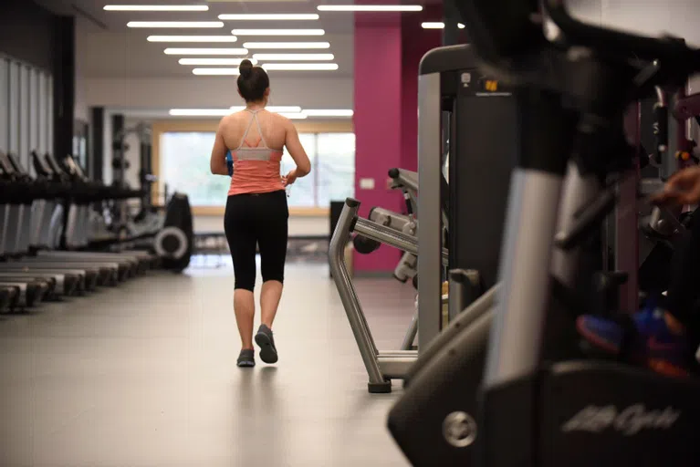 Wellesley center working out in Fitness Center