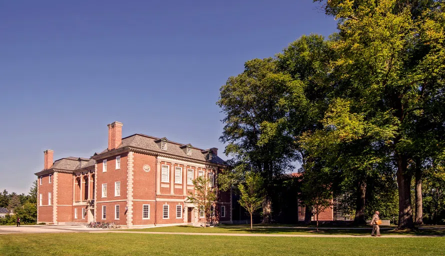 side of Sawyer library with trees by the South entrance