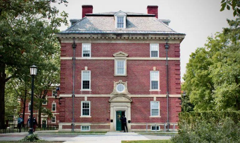 side of Sage Hall, a red brick building comprising half of the quad