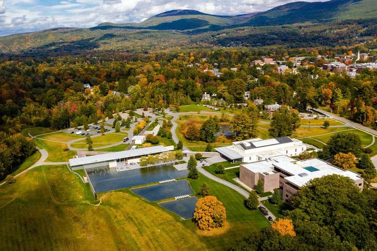 aerial image of the Clark Art Institute grounds, including white museum buildings, a reflecting pool and fall trees