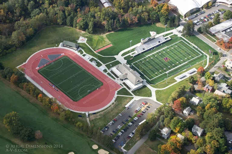 aerial image of Weston Athletic Complex, including two fields and a track, surrounded by trees and buildings