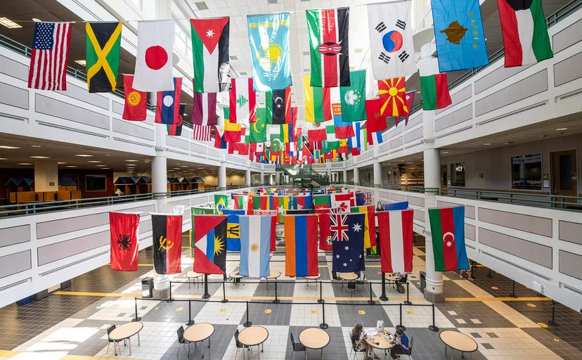 Nations' flags hanging inside the Johnson Center