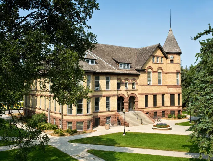 The cornerstone was laid in 1891 and tradition has it that at the dedication no flag was available, so a student made a makeshift pennant with a pair of overalls.