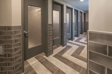 The recently renovated shared bathrooms in Churchill Hall have privatized bathroom stalls and showers on each wing of each floor.