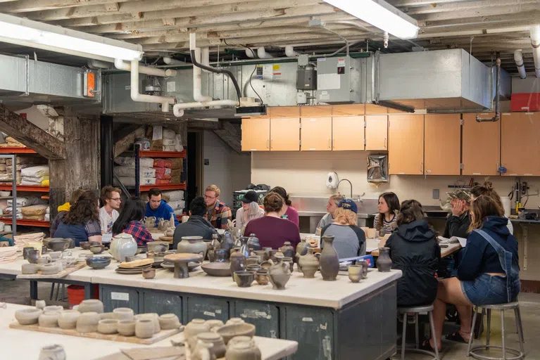 Talk with fellow students while you wait for your pottery pieces to dry!