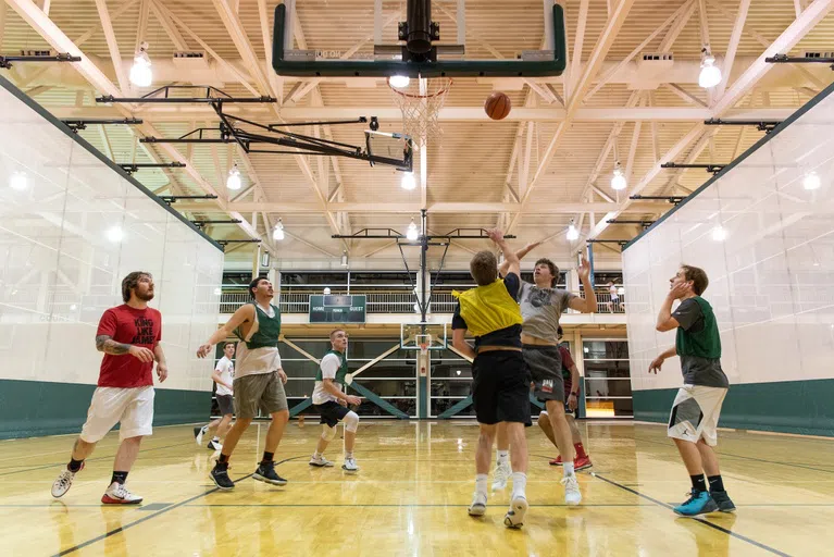 Lots of students utilize the basketball courts in the Wellness Center to get a good game with friends in!