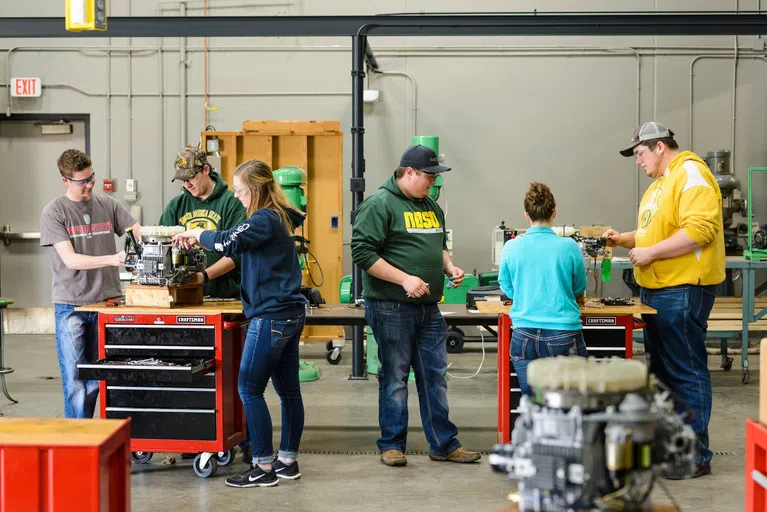 Student organizations give students the ability to meet students with similar interests and gain critical soft skills. Here, the Bison Pullers organization has students building engines for tractors.