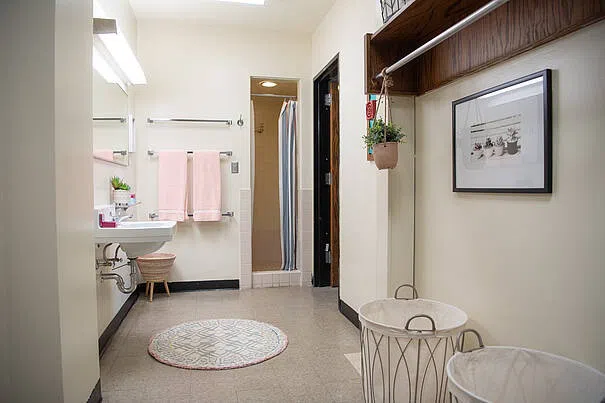 In suit-style living arrangements, you will share a foyer and bathroom space with three other people.